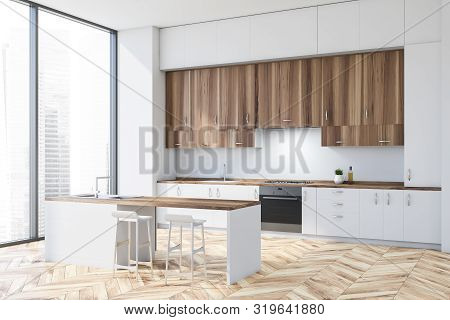Corner Of Modern Kitchen With White Walls, Wooden Floor, White Countertops, Wooden Cupboards And Whi