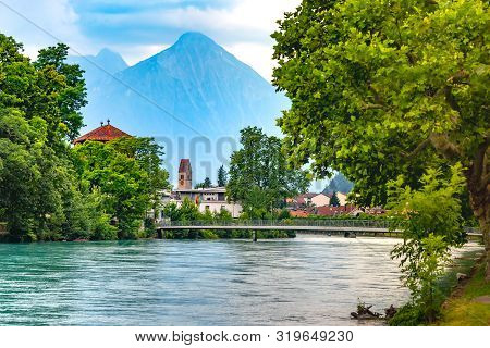 Panoramic View Of Old City Of Unterseen With Church And Aare River, Interlaken, Important Tourist Ce