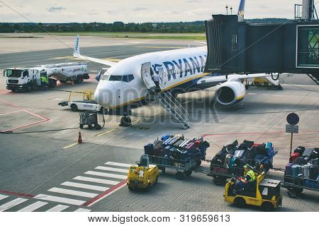 Gdansk / Poland - August 4 2019: Checked Freight Cargo Luggage Being Driven Towards A Ryanair Aeropl