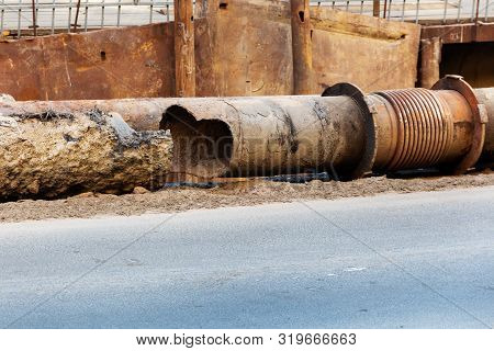 A Big Hole In An Old Rusty Heat Pipe. Emergency Repair Of A Worn-out Heating System. Replacing The O