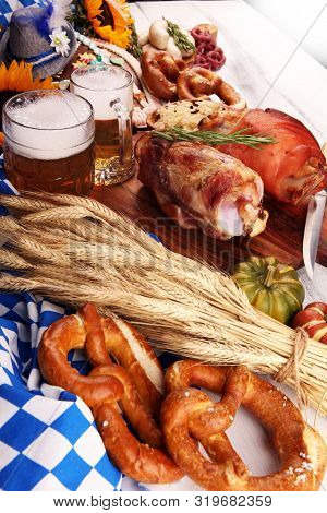 Traditional German Cuisine, Schweinshaxe Roasted Ham Hock. Beer, Pretzels And Various Bavarian Speci