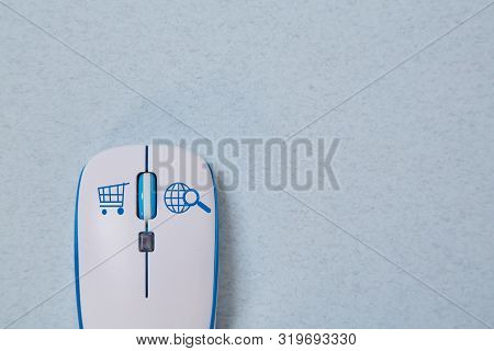 Online Store And Internet Shopping. Computer Mouse With Symbol Of Basket And Oline Searching
