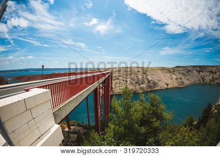 Red Bridge Over The Canyon In Croatia. View From The Bridge To The Canyon In The Krka National Park.