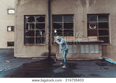Portrait Of A Handsome Caucasian Hip Hop Dancer, Freestyling Outdoors In An Old Abandoned Building