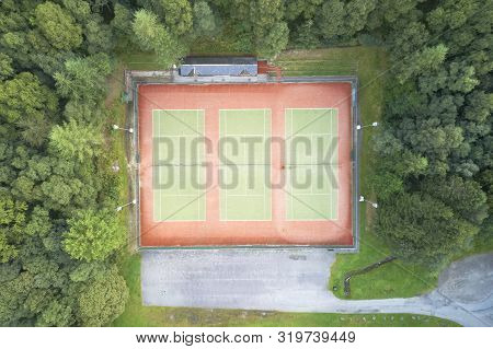 Tennis clay court empty aerial view from above