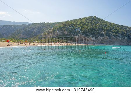 Rocky Coast Of The Island Of Sardinia In The Mediterranean Sea Viewed From A Boat