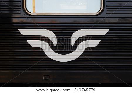 Nykoping, Sweden - August 28, 2019: The Railroad Company Sj White Logo Painted On A Black Passenger 