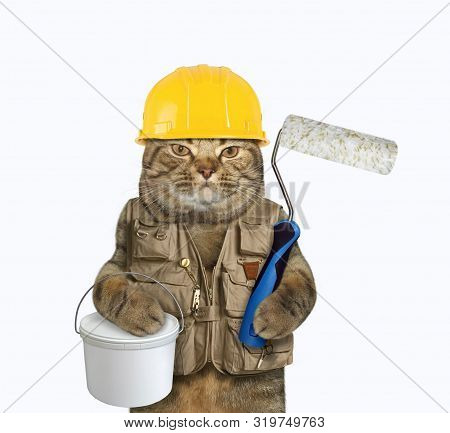 The Cat Worker In A Yellow Helmet And A Construction Vest Is Holding A Plastic Tin Of Paint And A Ro