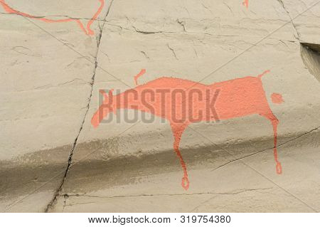 Rock Art In Alta Fjord, Norway. Ancient Symbols, Real Drawing,  Texture In Stone. Red Ocher Paint. H