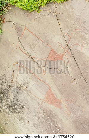 Rock Art In Alta Fjord, Norway. Ancient Symbols, Real Drawing,  Texture In Stone. Red Ocher Paint. H