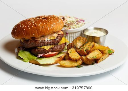 Burger With Double Pork Chop And Baked Potatoes
