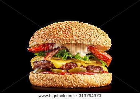 Burger At Black Background With Beef Or Pork Cutlet Or Steak With Fried Tomatoes, Cheddar Cheese, Pi