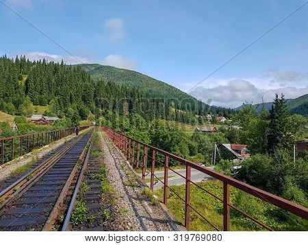 Beautiful Mountain Narrow-gauge Railway Road, Rails In The Mountains Of The Carpathians Passing Thro