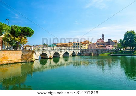 Famous Stone Arch Tiberius Bridge Ponte Di Tiberio Augustus Over Marecchia River Water, Old Building