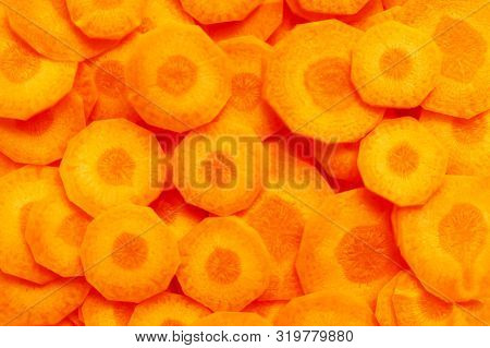 Background From Fresh Mugs Of Carrots. The Concept Of A Healthy Diet And Lifestyle.