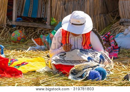 Titicaca Lake Peru, August 16 Woman In Typical Dress Working In One Of The Islands Of Titicaca.. Sho