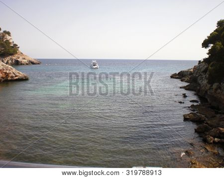 Boat Leaving The Port Of Cala Galdana In Es Migjorn Gran On Menorca Island. July 5, 2012. Menorca, B
