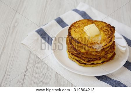 Homemade Corn Meal Johnny Cakes With Butter On A White Plate, Side View. Copy Space.