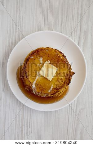 Homemade Corn Meal Johnny Cakes  On A White Plate On A White Wooden Background, Overhead View. Flat 