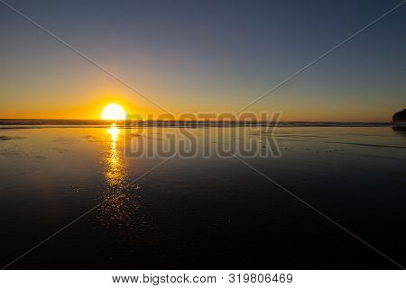 Sunset At Piha Beach, North Island, New Zealand