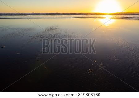 Sunset At Piha Beach, North Island, New Zealand