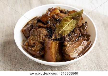 Homemade Filipino Adobo Pork In A Bowl, Side View. Close-up.