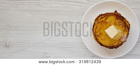 Homemade Corn Meal Johnny Cakes With Butter On A White Plate On A White Wooden Surface, Top View. Fl