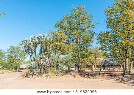 Kruger National Park, South Africa - May 13, 2019: A View Of  Shingwedzi Rest Camp. Buildings And Tr