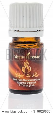 Winneconne, Wi - 28 August 2019 : A Bottle Of Young Living Light The Fire Oil On An Isolated Backgro