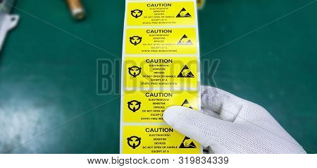 Hand Holding Esd Symbol Label With Antistatic Gloves,electrostatic Sensitive Devices (esd) In Electr