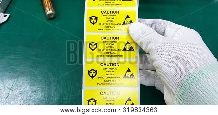 Hand Holding Esd Symbol Label With Antistatic Gloves,electrostatic Sensitive Devices (esd) In Electr