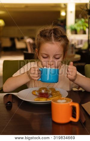 Breakfast In A Cafe For Young Lady