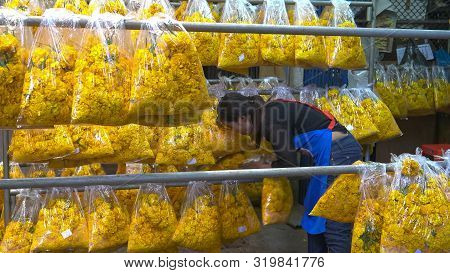 Bangkok, Thailand- June, 22, 2017 Close Up Of A Thai Woman Sorting Garlands In Bangkok