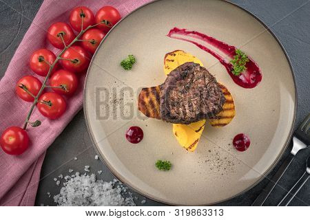 Steak Filet Mignon With Smoke. Baked Potatoes And Cranberry Sauce. ?herry Tomatoes. Grey Background