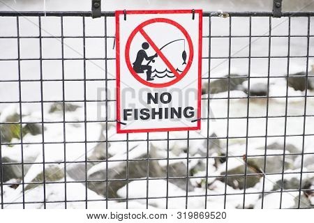 No Fishing Sign And Icon At Seaside Coast Sidewalk