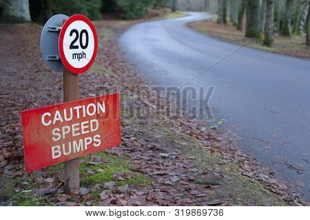 Speed Bumps Caution 20 Mph Sign In Rural Countryside Estate