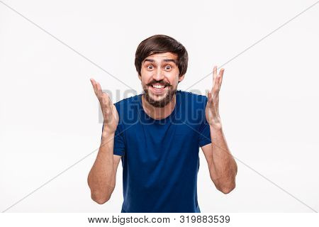 Handsome Brunet Man In A Blue Shirt With Beard And Mostaches Shouting Shrugging His Shoulders Being 