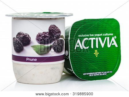 London, Uk - August 18, 2019: Cup Of Activia Exclusive Live Yogurt Cultures With Prunes On White Bac