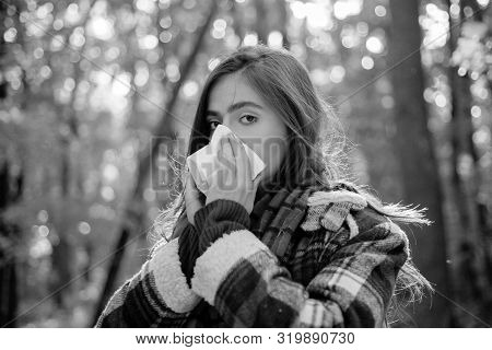 Napkin Sneezing In The Yellow Park. Sick People Has Runny Nose. Allergy Season. Woman Makes A Cure F
