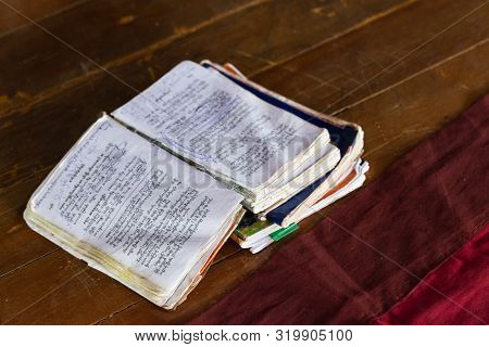 Inle, Myanmar - April 2019: Open Study Books In Burmese School For Novice Monks