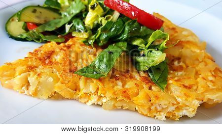 Omelet Made With Fresh Salad And Onions