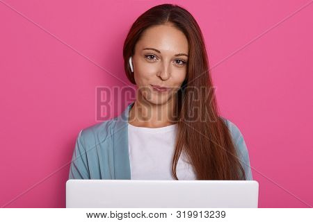 Image Of Businesswoman Sitting In Front Laptop, Attractive Female Posing Isolated Over Pink Studio B