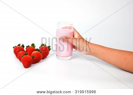 Red Strawberry  And Young Woman Hand Grap Glass Of Strawberry Juice