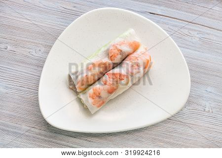Top View Of Nem Cuon (fresh Vietnamese Nem Roll With Shrimps, Mango And Ginger) On White Plate On Wo