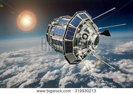 Space satellite orbiting the earth. Elements of this image furnished by NASA.