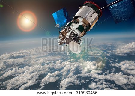 Space satellite orbiting the earth. Elements of this image furnished by NASA.