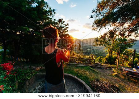 Young Woman Juggling With Bolls On The Lake
