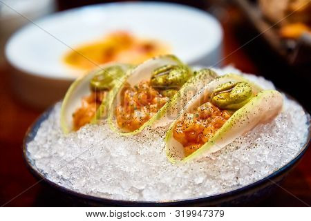 Ceviche Or Salmon Tartare In Daikon Slices.