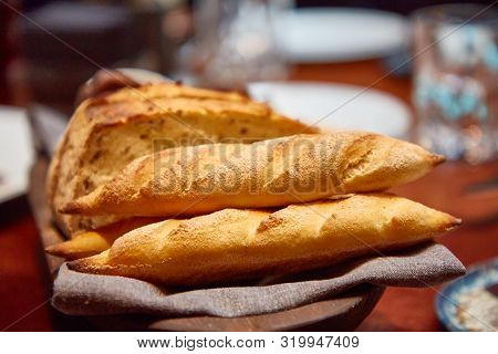 Basket With Different Bread On The Table In The Restaurant
