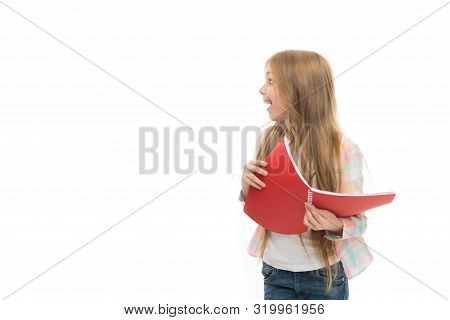 Back To School Goods. Cute Little Girl Holding School Exercise Book. Adorable Small School Child Wit